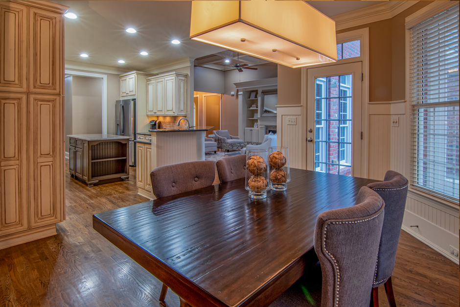 Warmly lit kitchen interior with wooden cabinets.