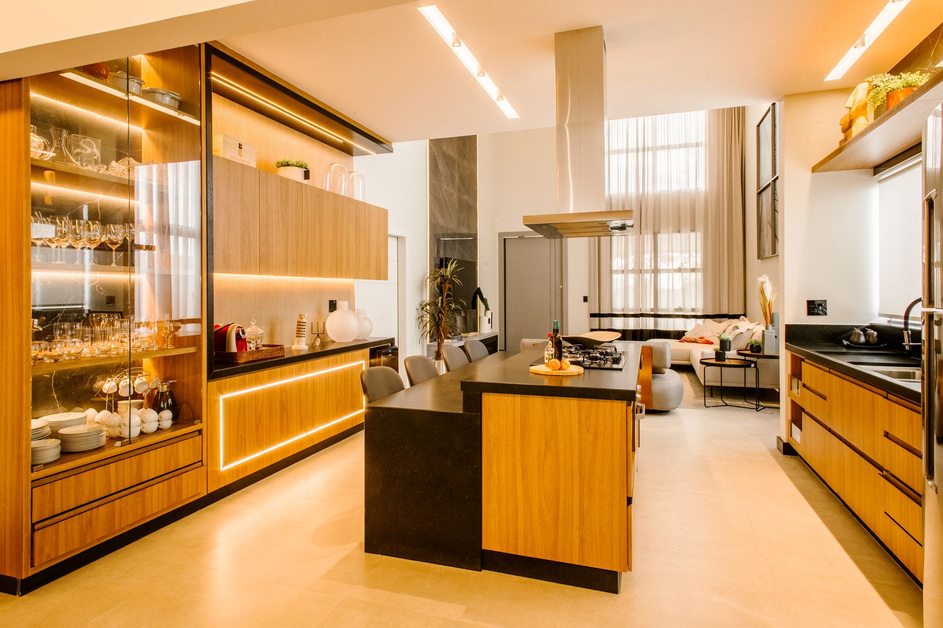 Sleek modern kitchen featuring wooden cabinetry and elegant lighting in Austin, TX